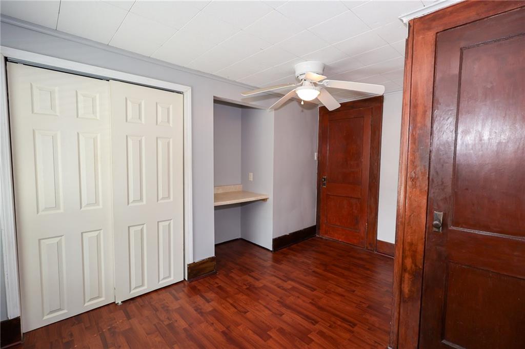 311 Center Street Slippery Rock, PA 16057 - Photo 18 of 32 wooden floor in an empty room with a window