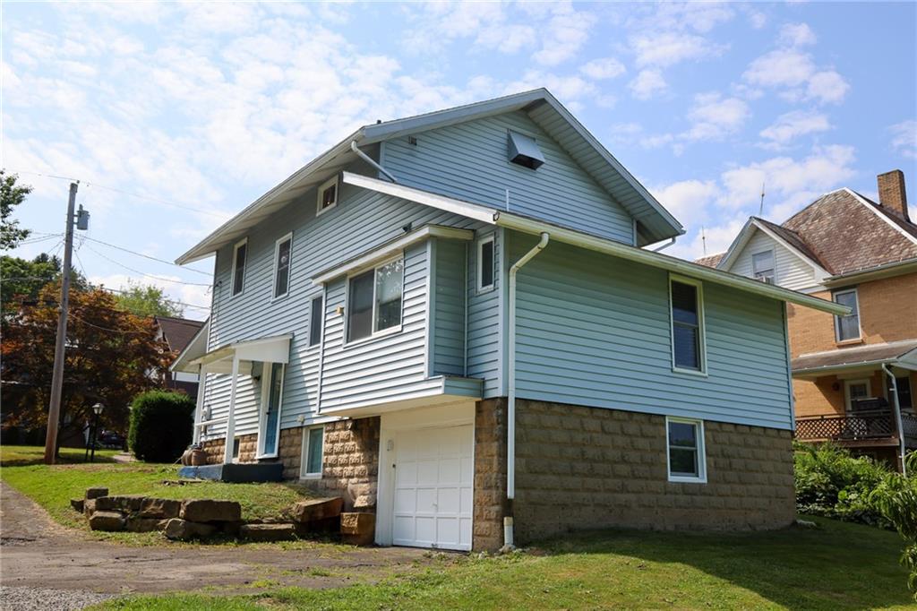 311 Center Street Slippery Rock, PA 16057 - Photo 2 of 32 a front view of a house with a yard