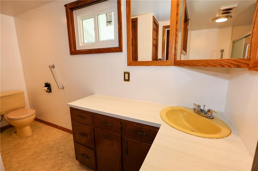311 Center Street Slippery Rock, PA 16057 - Photo 21 of 32 a bathroom with a sink a toilet and mirror
