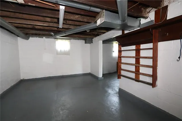a view of a livingroom with wooden floor and a window