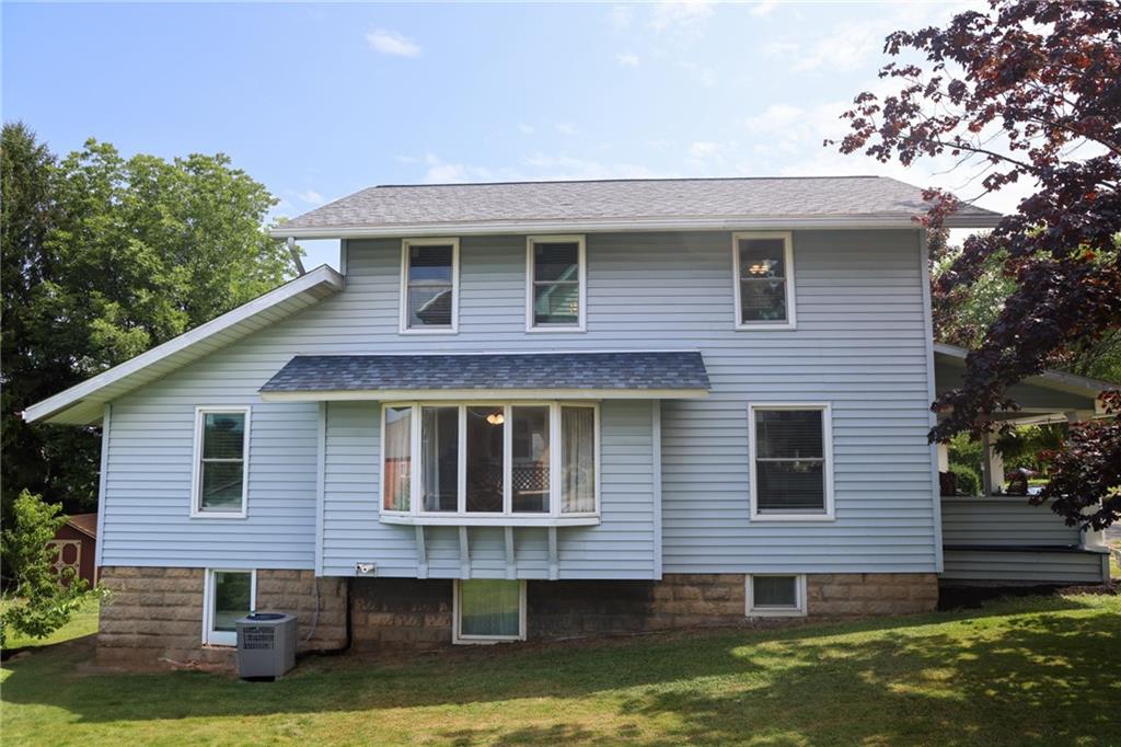 311 Center Street Slippery Rock, PA 16057 - Photo 3 of 32 a front view of a house with a yard and garage