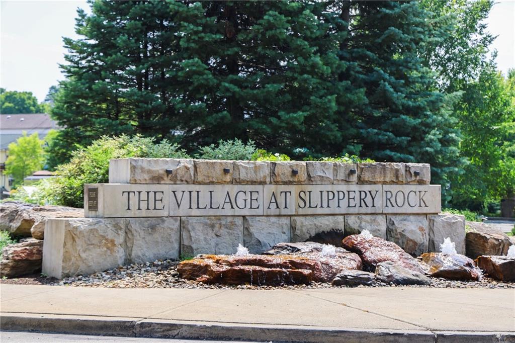 311 Center Street Slippery Rock, PA 16057 - Photo 32 of 32 a sign that is sitting on the side of a road