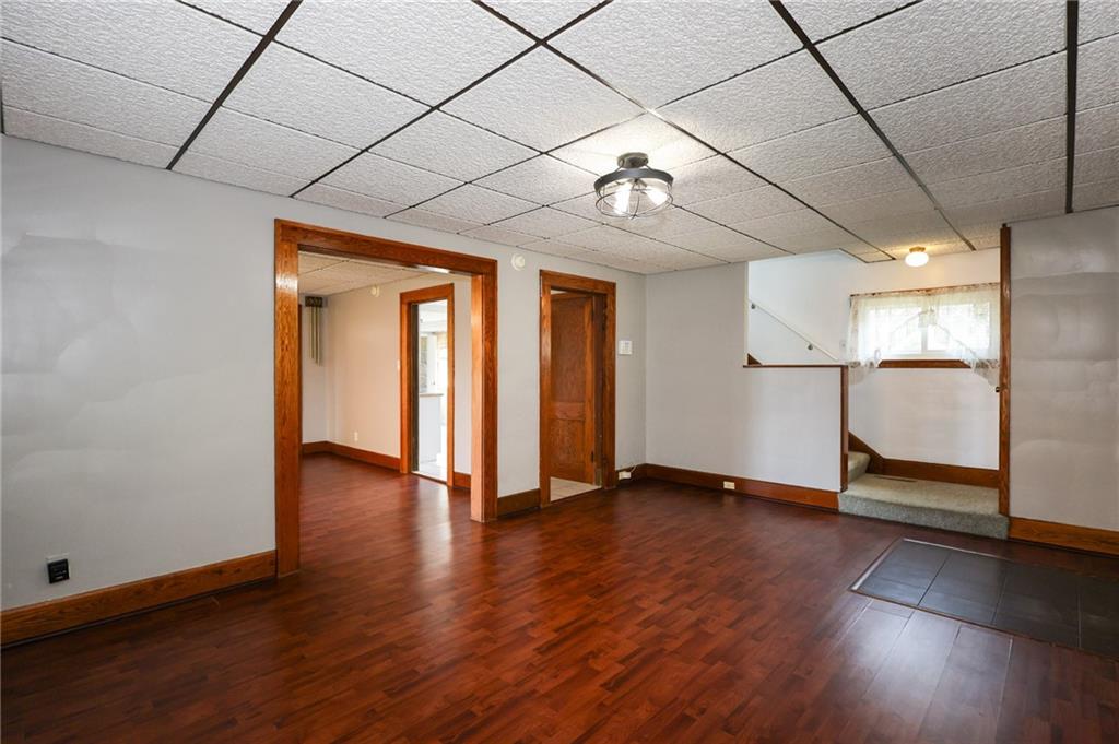311 Center Street Slippery Rock, PA 16057 - Photo 6 of 32 an empty room with wooden floor and natural light