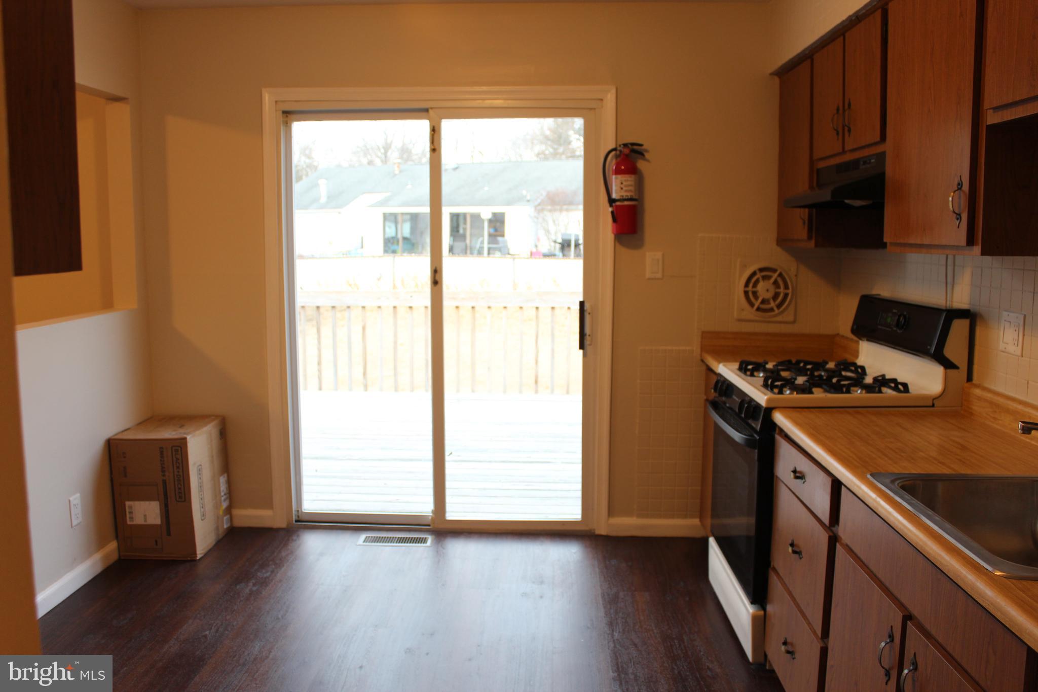 317 Overbrook Avenue Glassboro, NJ 08028 - Photo 7 of 11 a kitchen with stainless steel appliances granite countertop a stove and a refrigerator