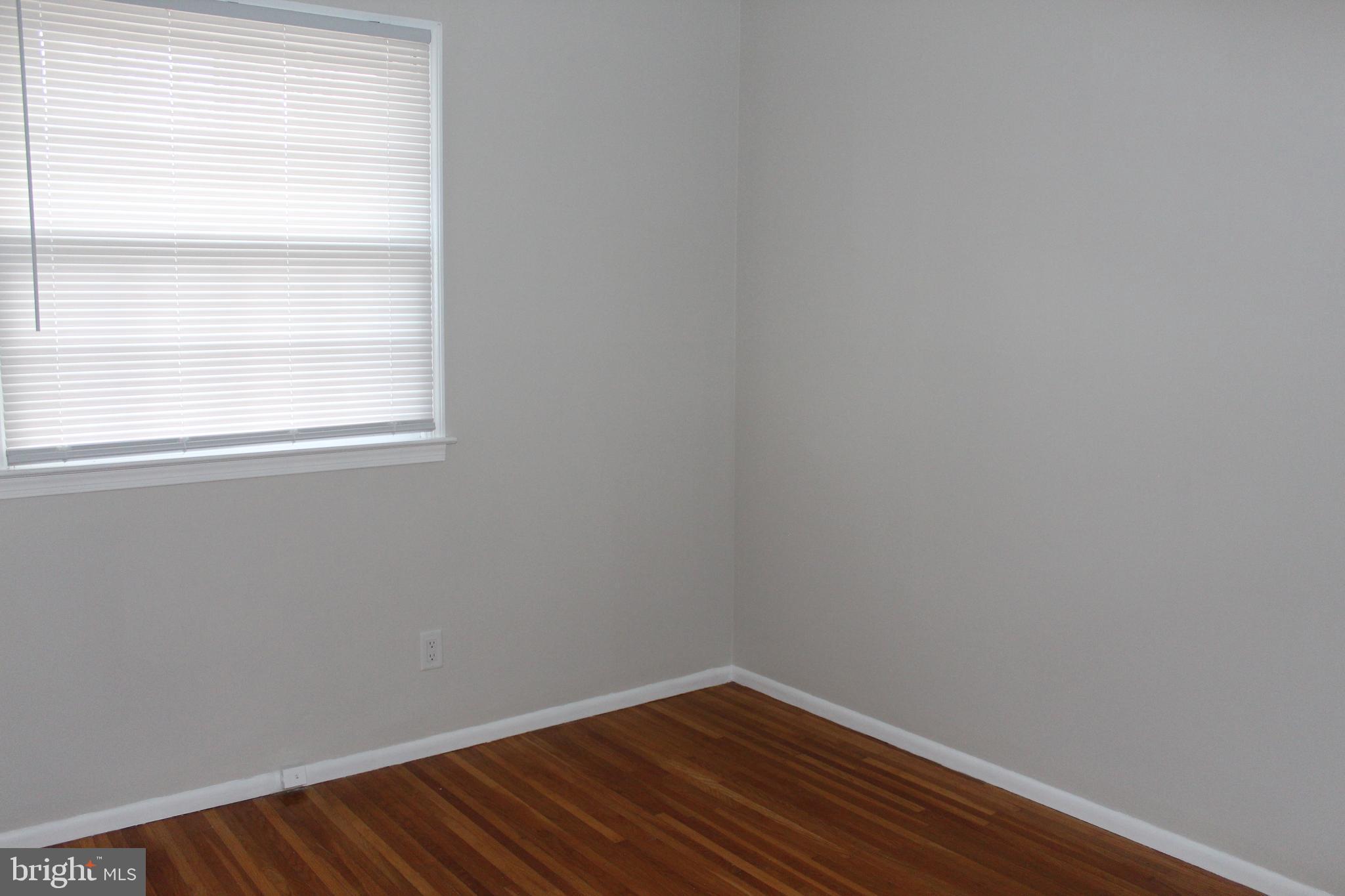 317 Overbrook Avenue Glassboro, NJ 08028 - Photo 10 of 11 a view of a small space with wooden floor and a window