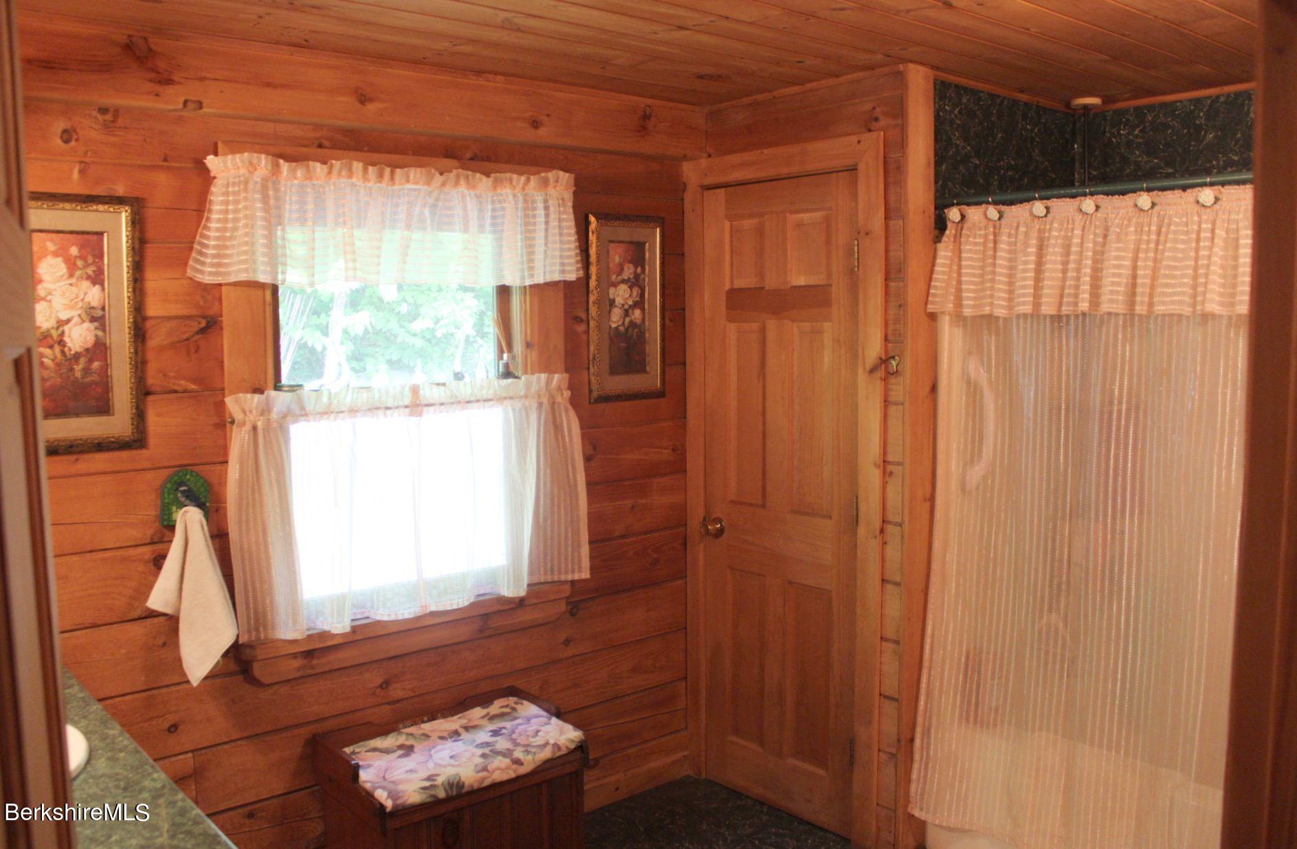 175 River Road Windsor, MA 01270 - Photo 14 of 22 a room with a window and a wooden floor