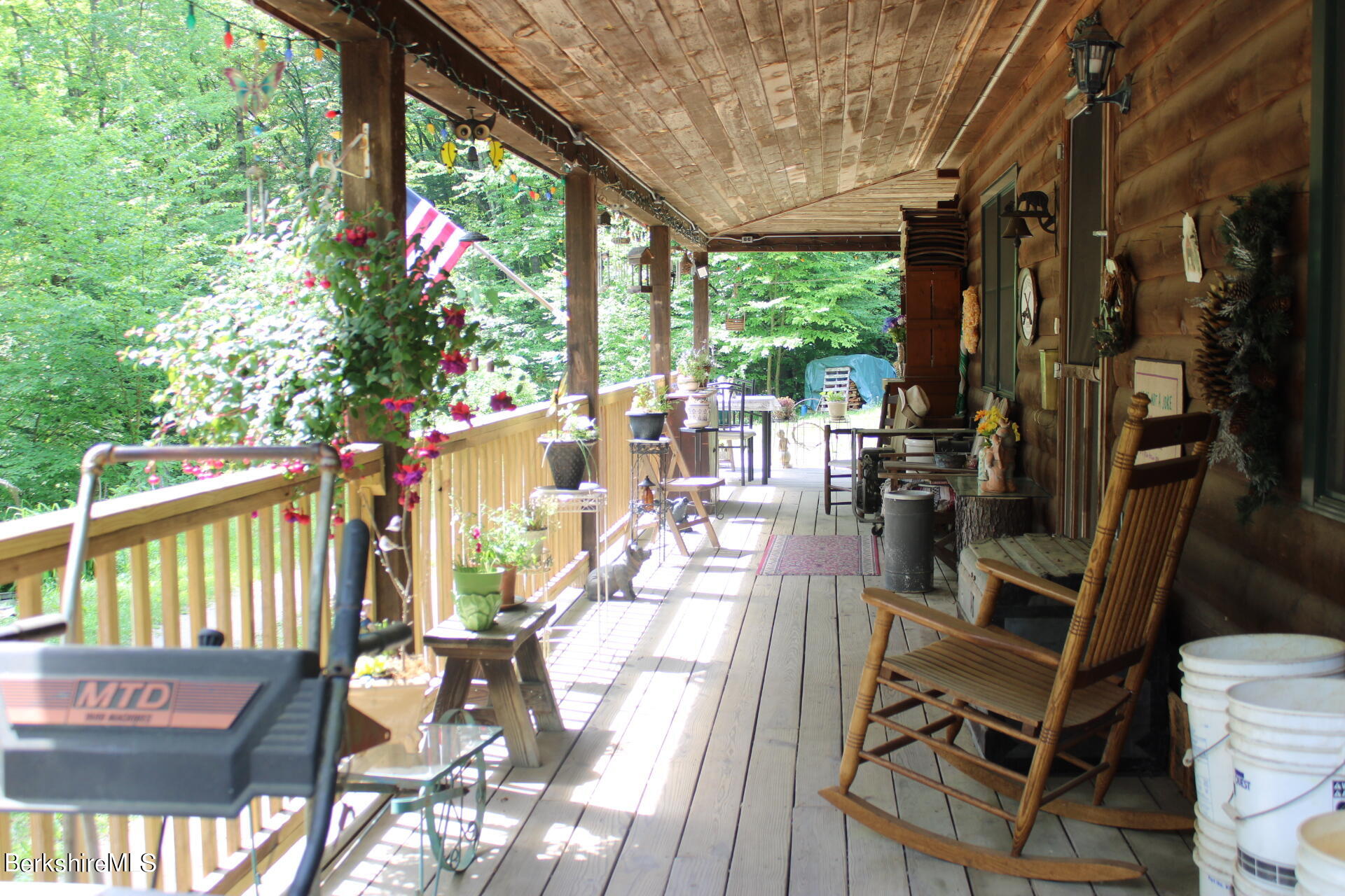 175 River Road Windsor, MA 01270 - Photo 5 of 22 a view of balcony with wooden floor and outdoor seating
