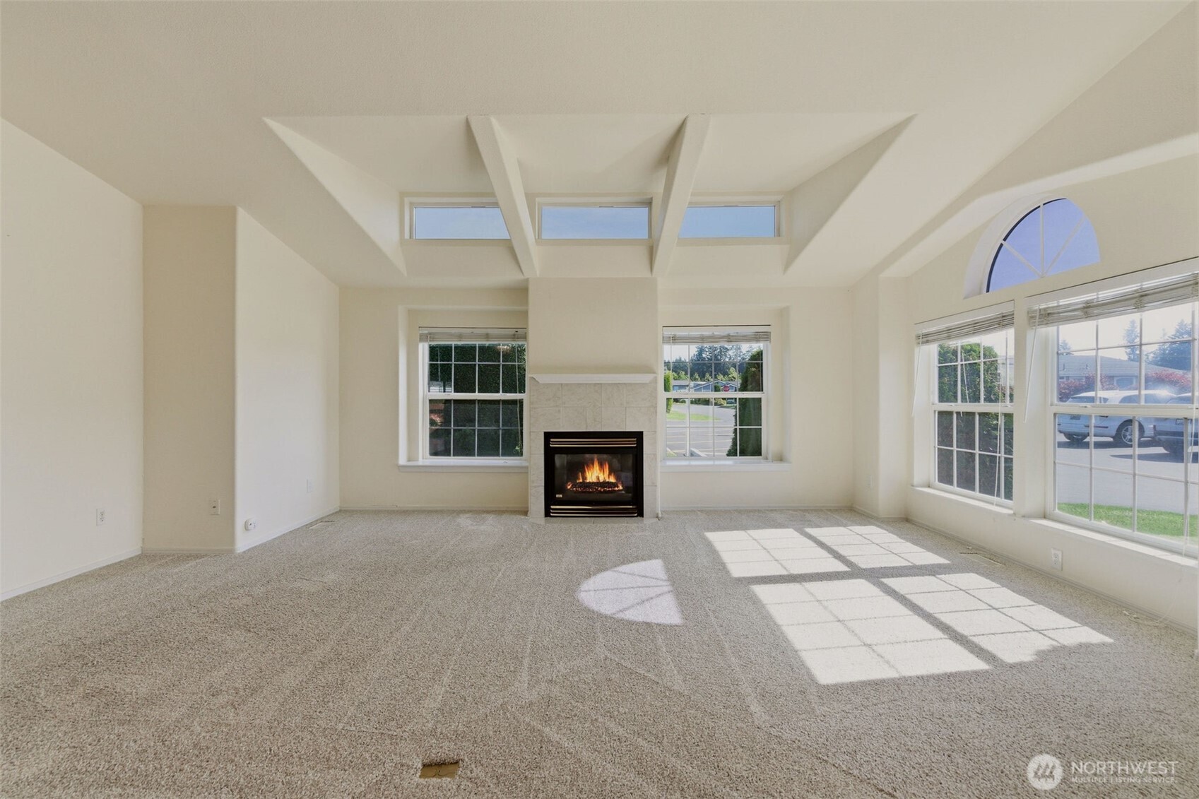 24036 222nd Avenue Southeast Maple Valley, WA 98038 - Photo 6 of 37 a view of a livingroom with a fireplace and window