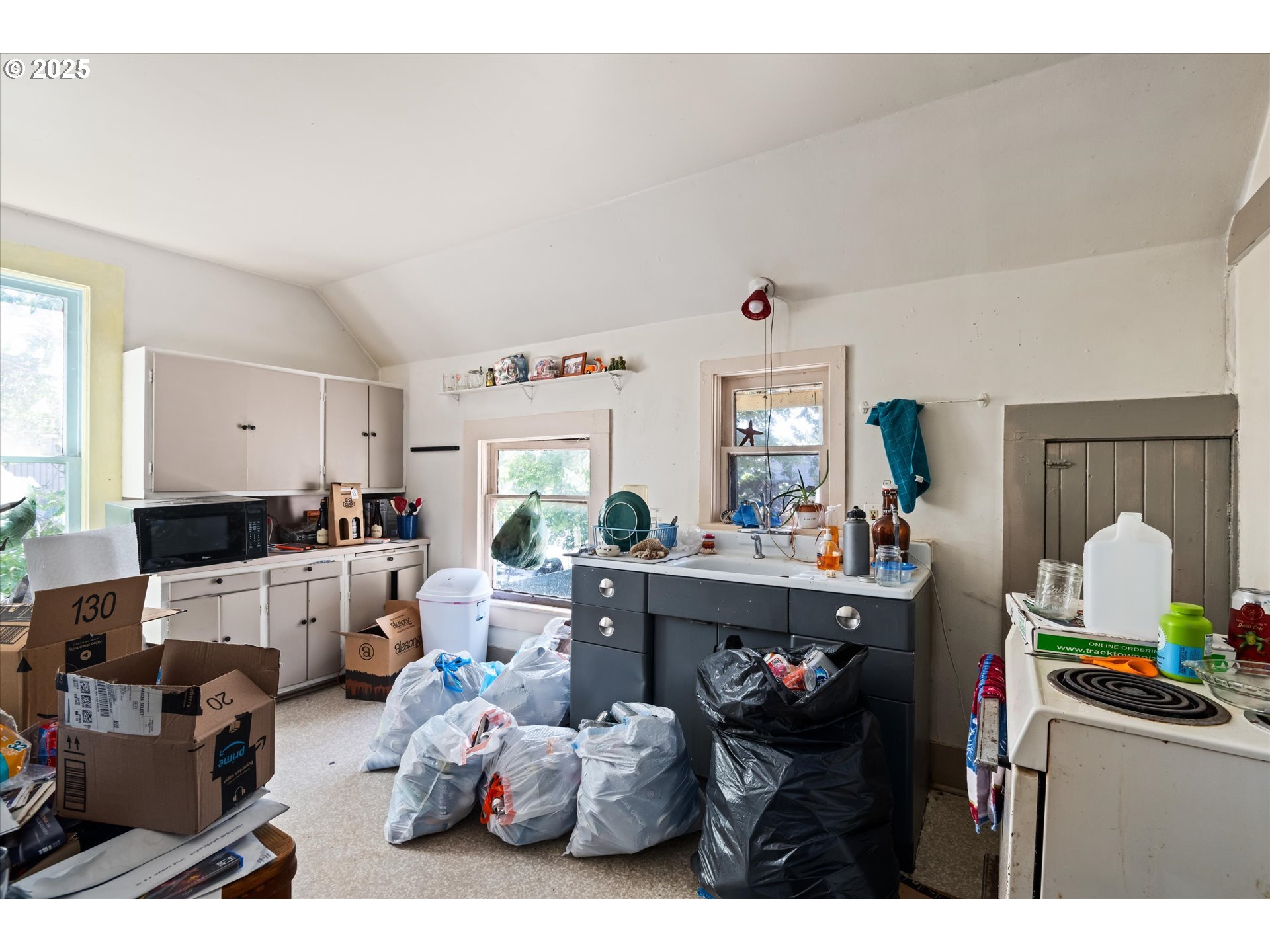 490 West 4th Avenue Eugene, OR 97401 - Photo 12 of 25 a living room with furniture and a chandelier