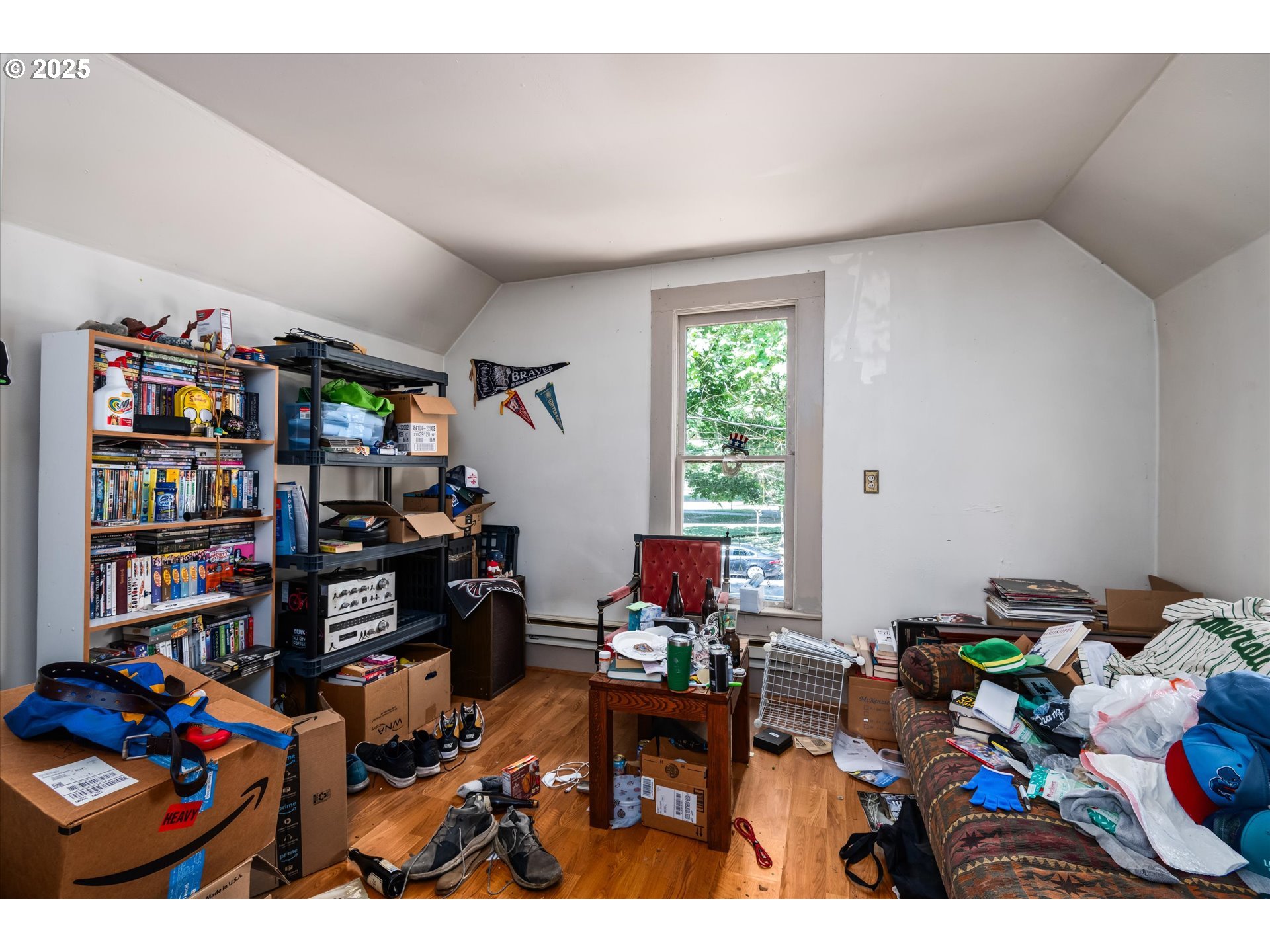 490 West 4th Avenue Eugene, OR 97401 - Photo 13 of 25 a living room with furniture a bookshelf and a window