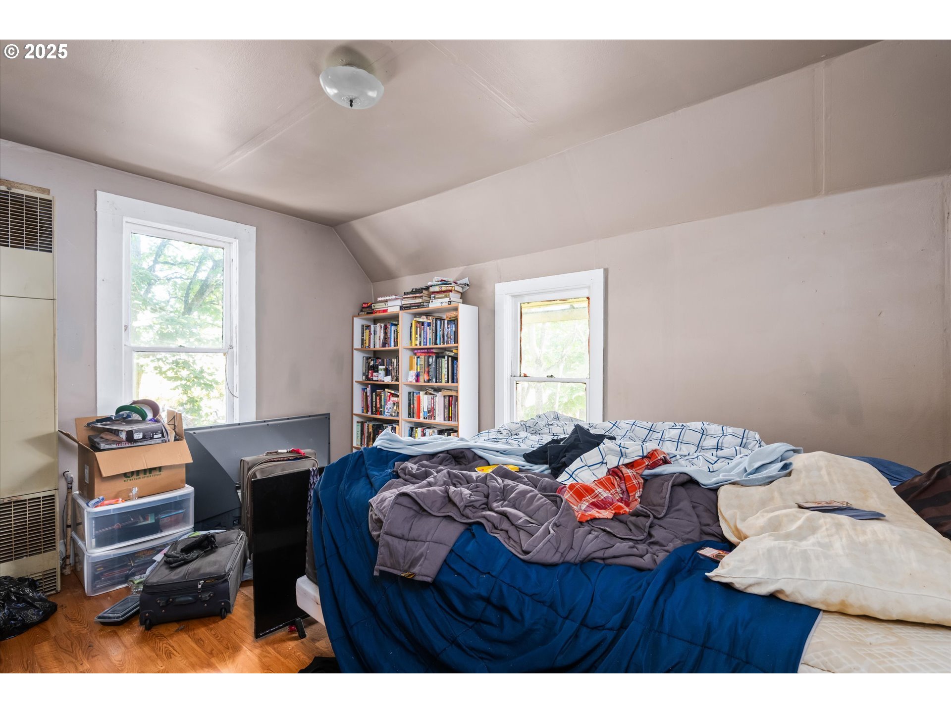 490 West 4th Avenue Eugene, OR 97401 - Photo 14 of 25 a bedroom with a bed and a window
