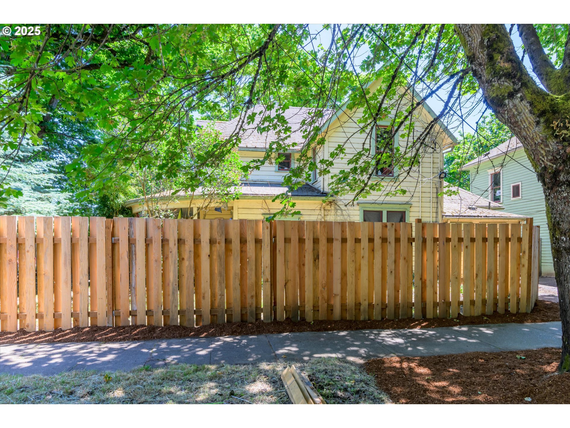 490 West 4th Avenue Eugene, OR 97401 - Photo 2 of 25 a view of outdoor space with wooden fence