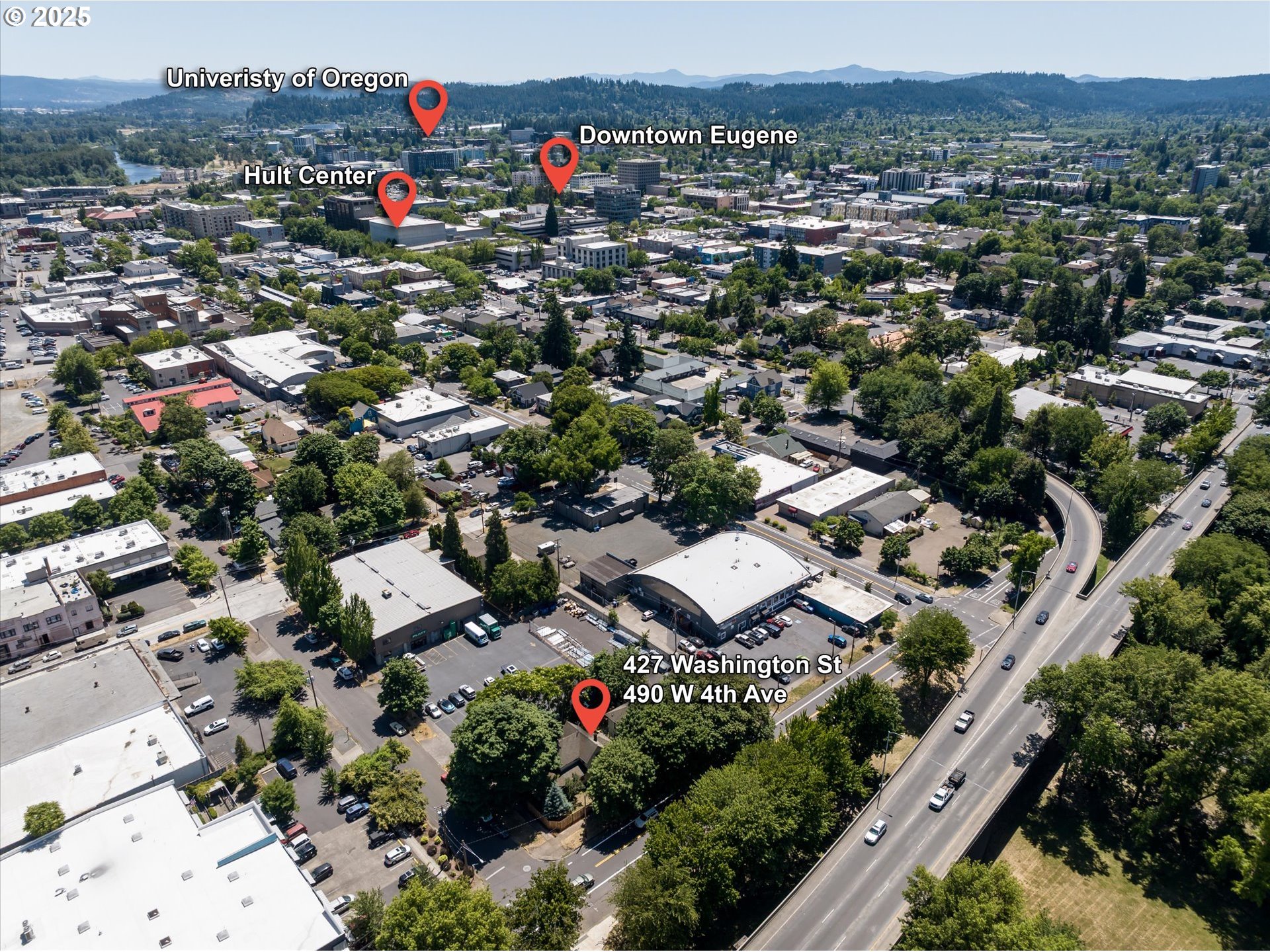 490 West 4th Avenue Eugene, OR 97401 - Photo 22 of 25 an aerial view of residential houses with outdoor space and trees