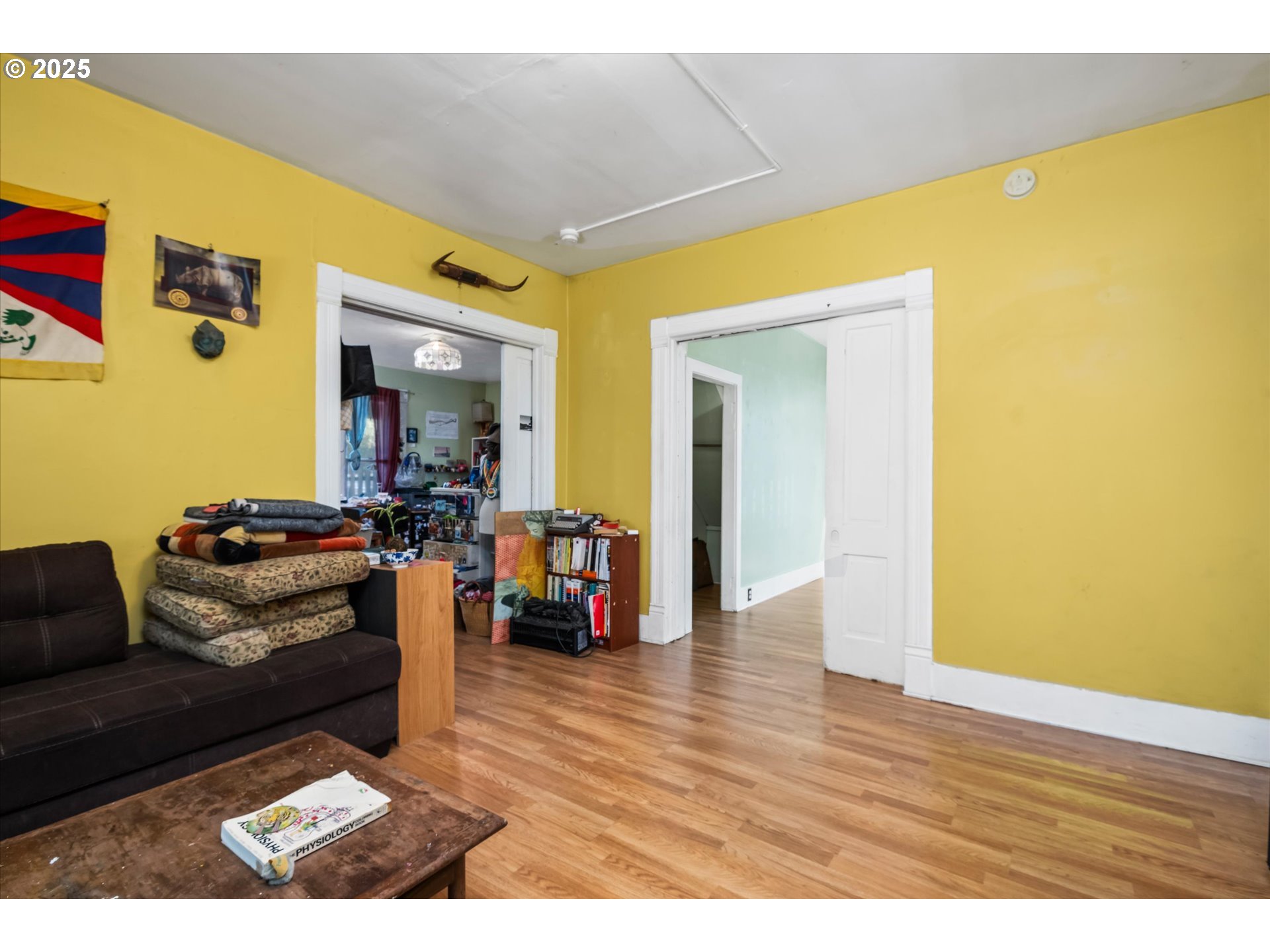 490 West 4th Avenue Eugene, OR 97401 - Photo 6 of 25 a living room with furniture and a wooden floor