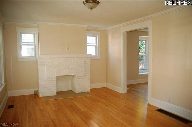 3307 Altoona Road, Unit 1 Cleveland, OH 44109 - Photo 5 of 7 Living room with decortive firepalce and newer bamboo floors!
