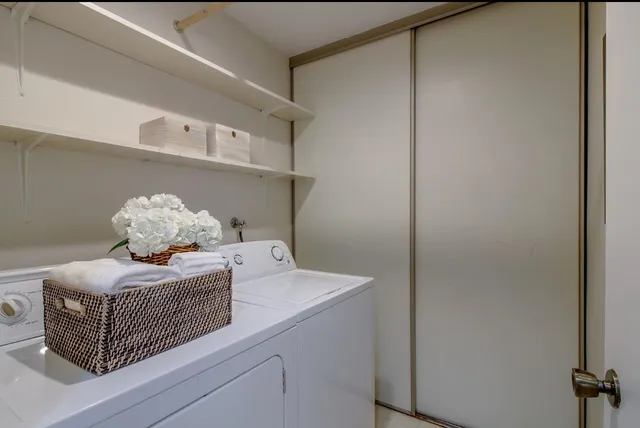 a view of an empty room with a cabinet