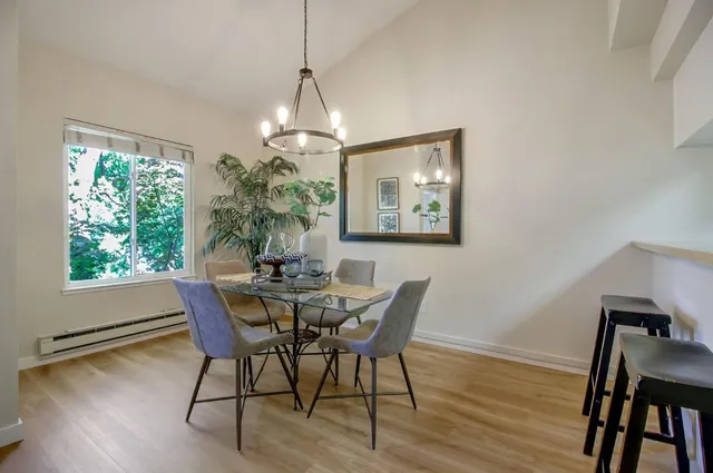 a view of a dining room with furniture window and wooden floor
