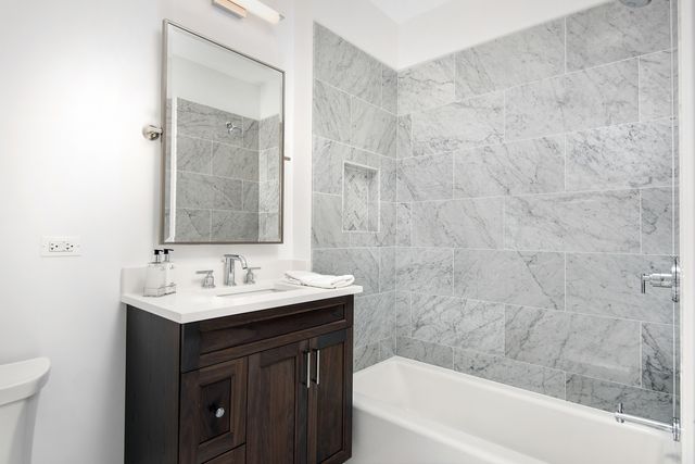 a bathroom with a sink and a bathtub