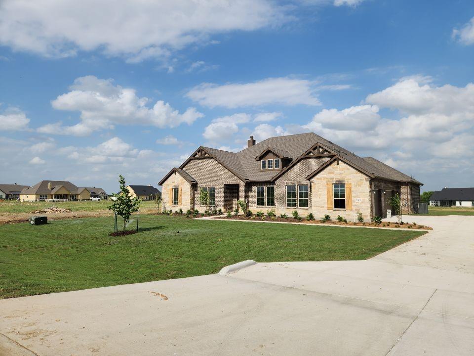 2408 Quartz Street Krum, TX 76249 - Photo 3 of 16 front view of a house with a yard