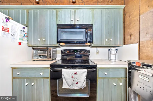 a bedroom with a large bed and a tv