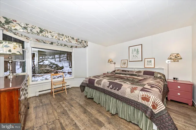 a bedroom with a bed and a view of bathroom