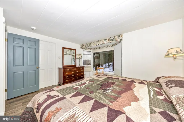 a bathroom with a sink mirror and vanity