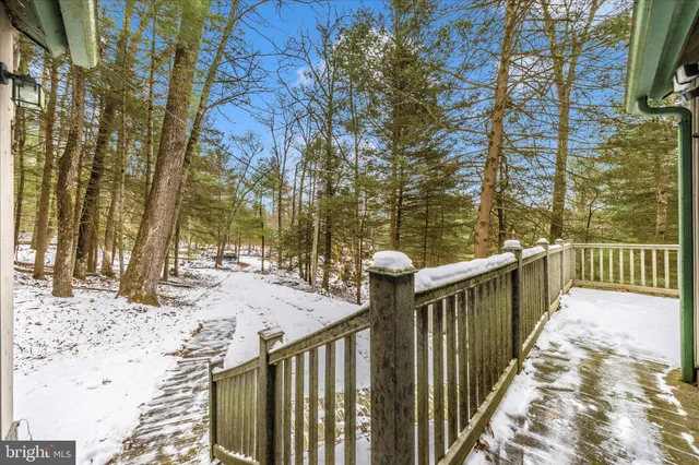 a view of a pathway with a wrought fence