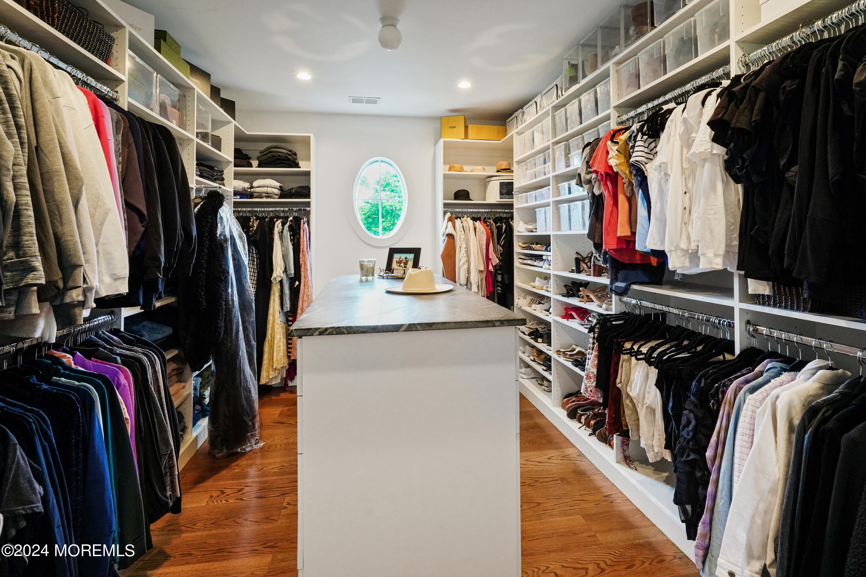 15 Mitchell Place Little Silver, NJ 07739 - Photo 19 of 39 a view of walk in closet with clothes and shoes