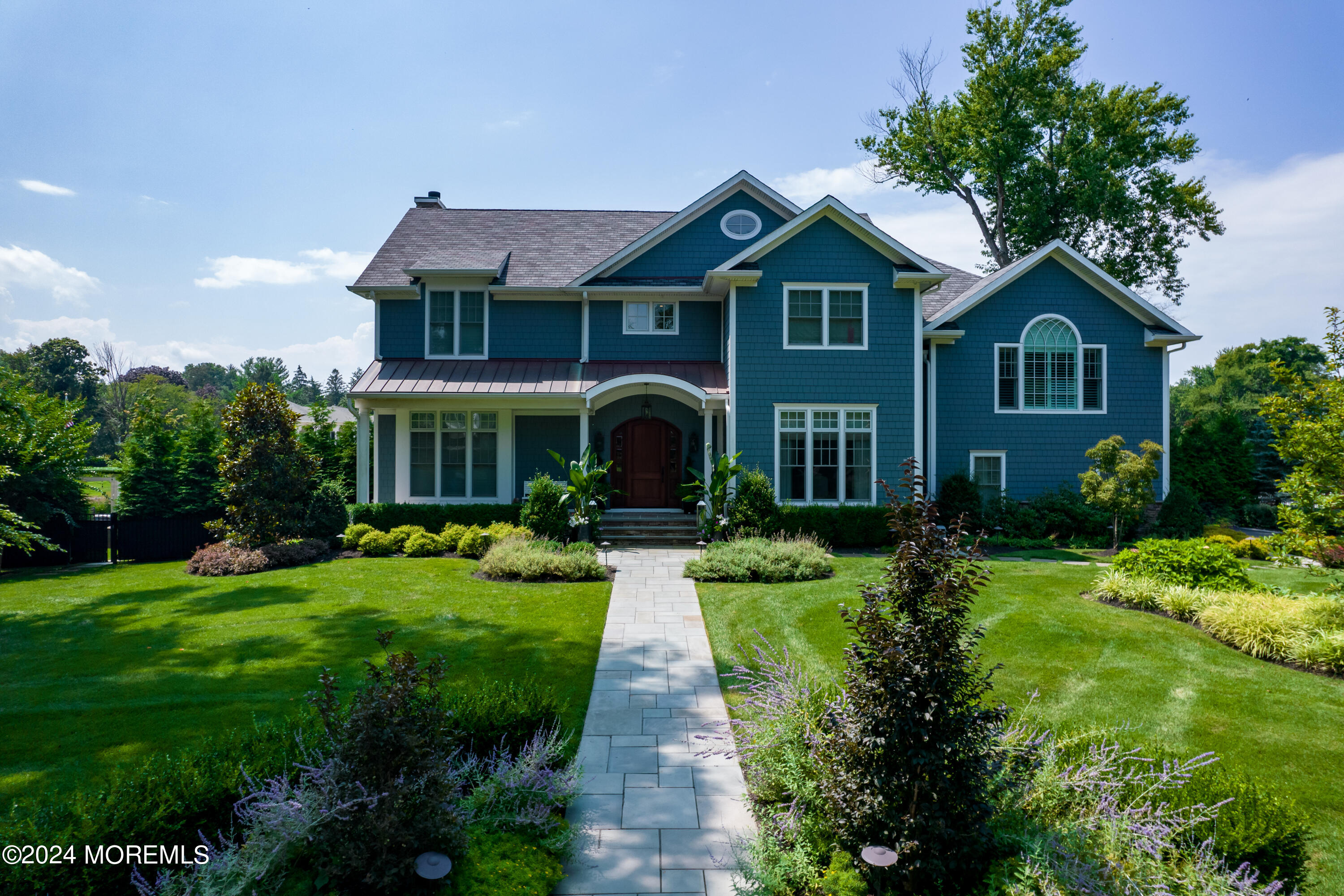 15 Mitchell Place Little Silver, NJ 07739 - Photo 2 of 39 a front view of a house with yard and green space