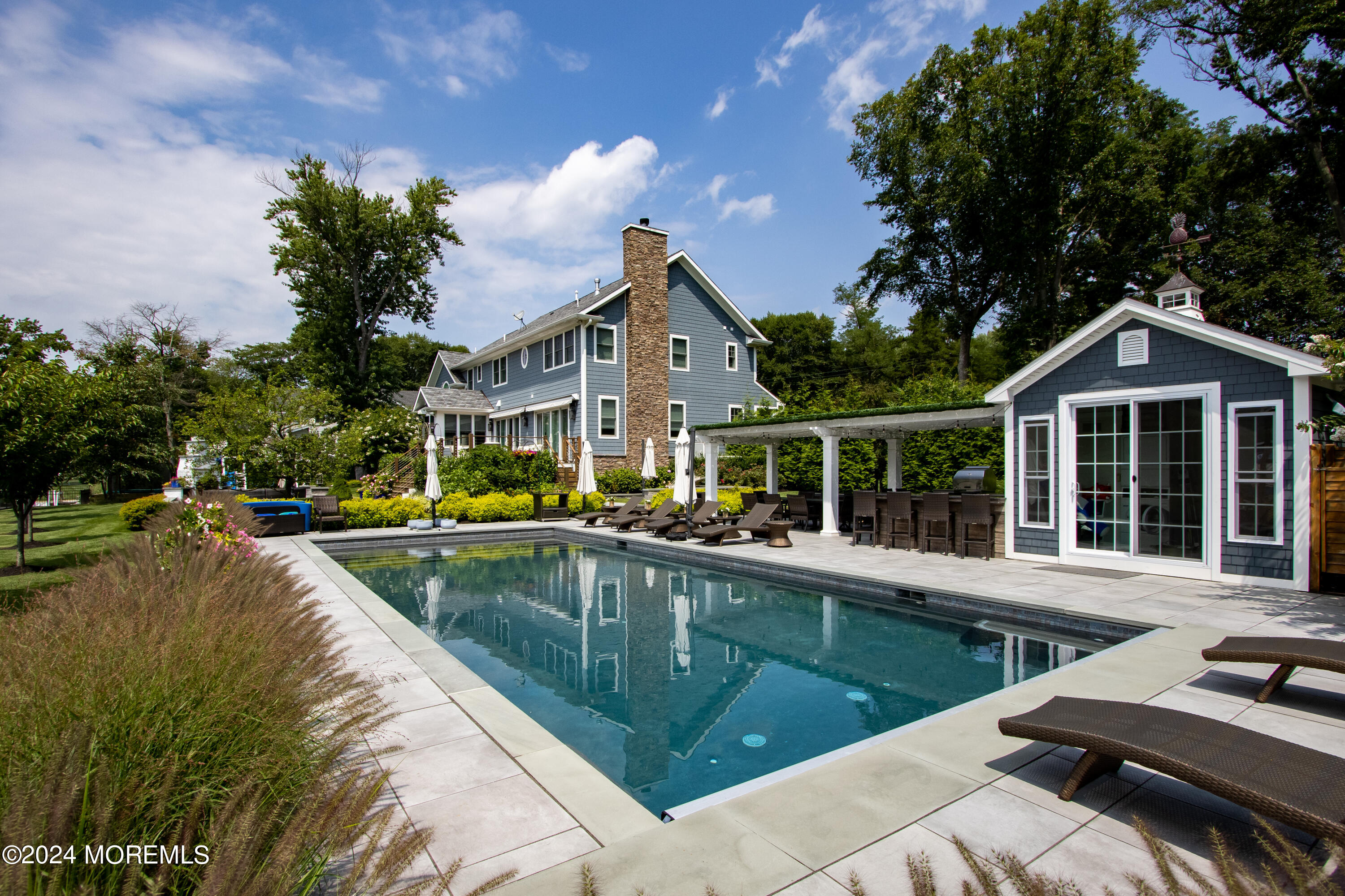 15 Mitchell Place Little Silver, NJ 07739 - Photo 31 of 39 a view of a house with pool and chairs