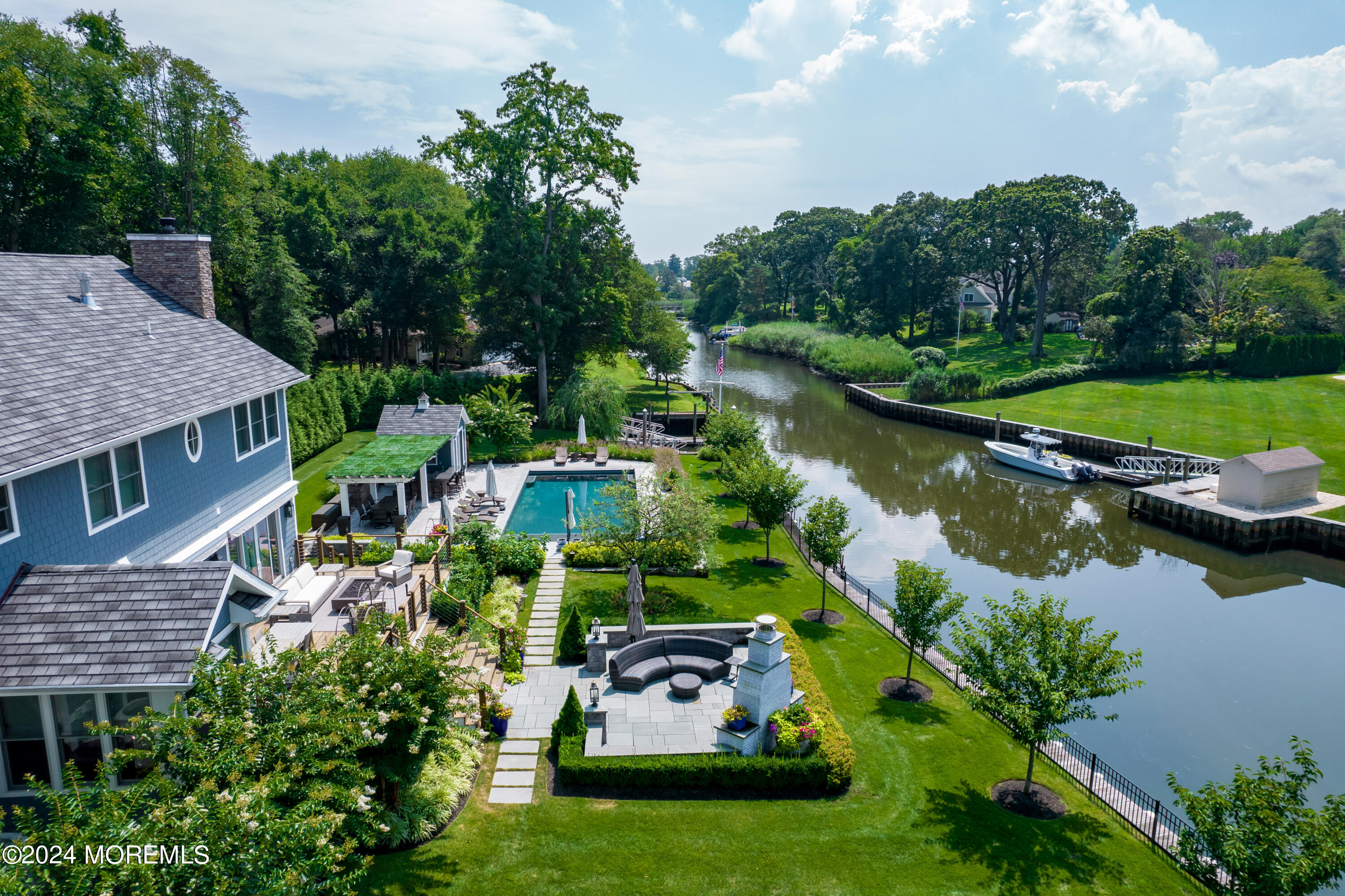 15 Mitchell Place Little Silver, NJ 07739 - Photo 35 of 39 an aerial view of a house with swimming pool a yard and lake view