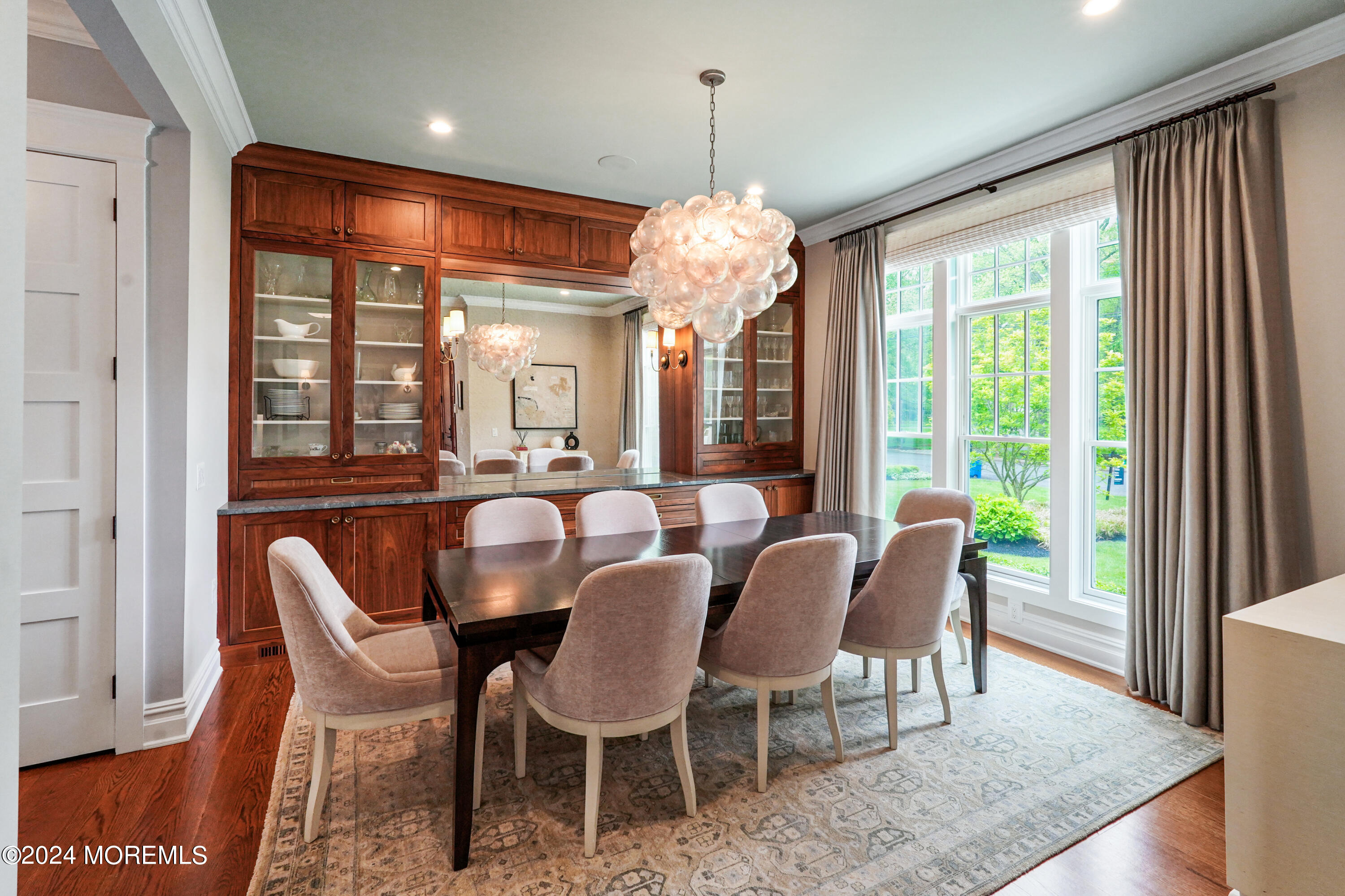 15 Mitchell Place Little Silver, NJ 07739 - Photo 5 of 39 a dining room with furniture a chandelier and wooden floor