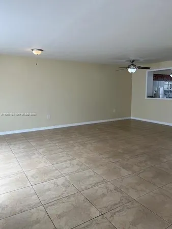a view of a livingroom with a furniture and chandelier fan