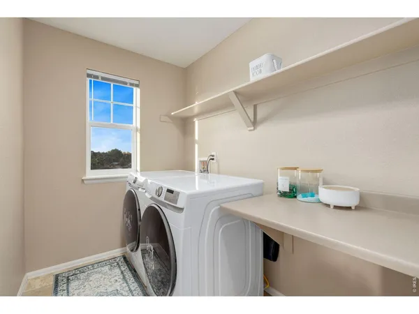 a bathroom with a granite countertop sink toilet a mirror and shower