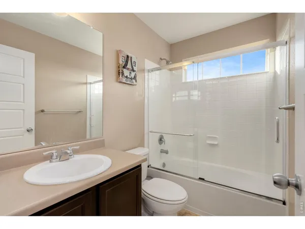 a open kitchen with sink and refrigerator