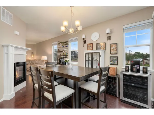 a kitchen with stainless steel appliances kitchen island granite countertop a refrigerator and a stove top oven