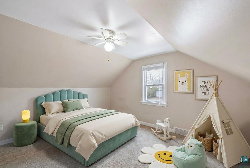 122 3rd Street Cloquet, MN 55720 - Photo 35 of 42 Bedroom featuring an angled ceiling and carpeted flooring