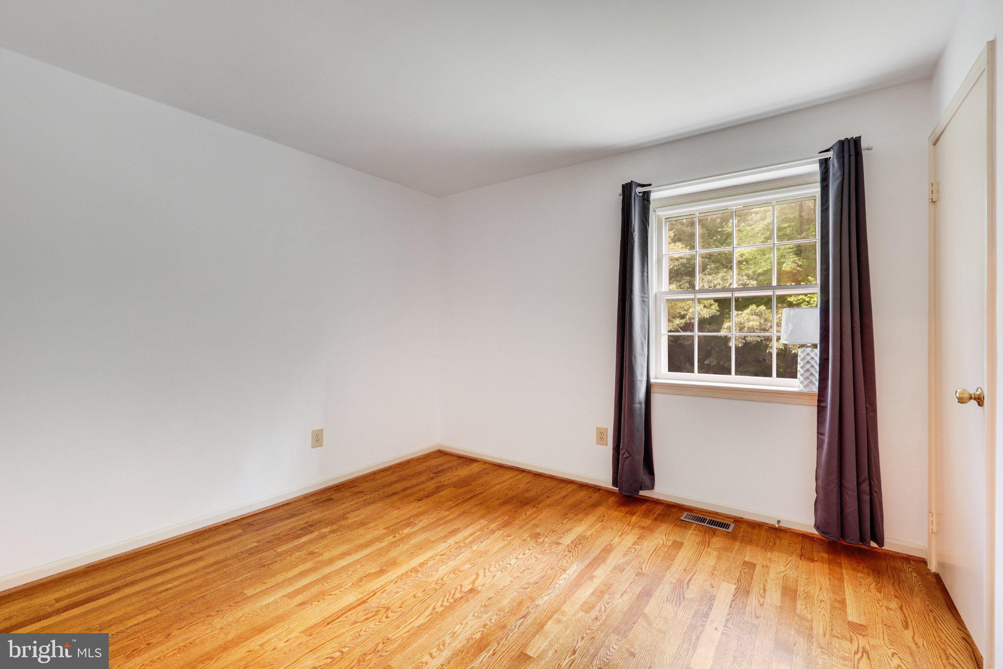 1427 Laurel Hill Road Vienna, VA 22182 - Photo 27 of 57 Bright and airy room with hardwood floors.