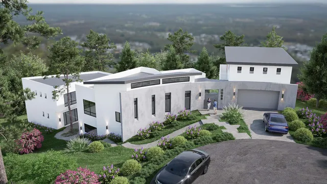 an aerial view of a house with yard and outdoor seating
