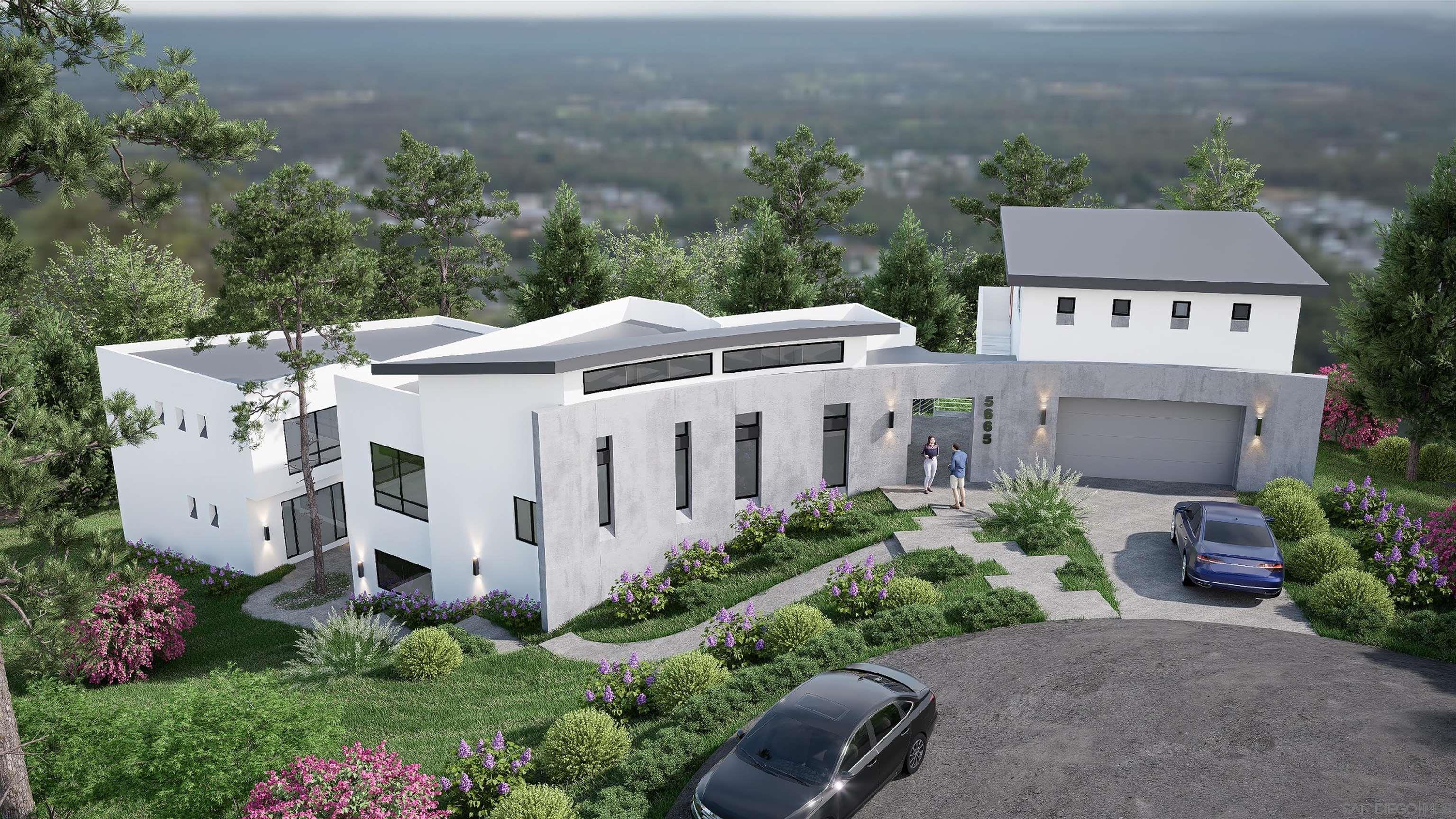 an aerial view of a house with yard and outdoor seating