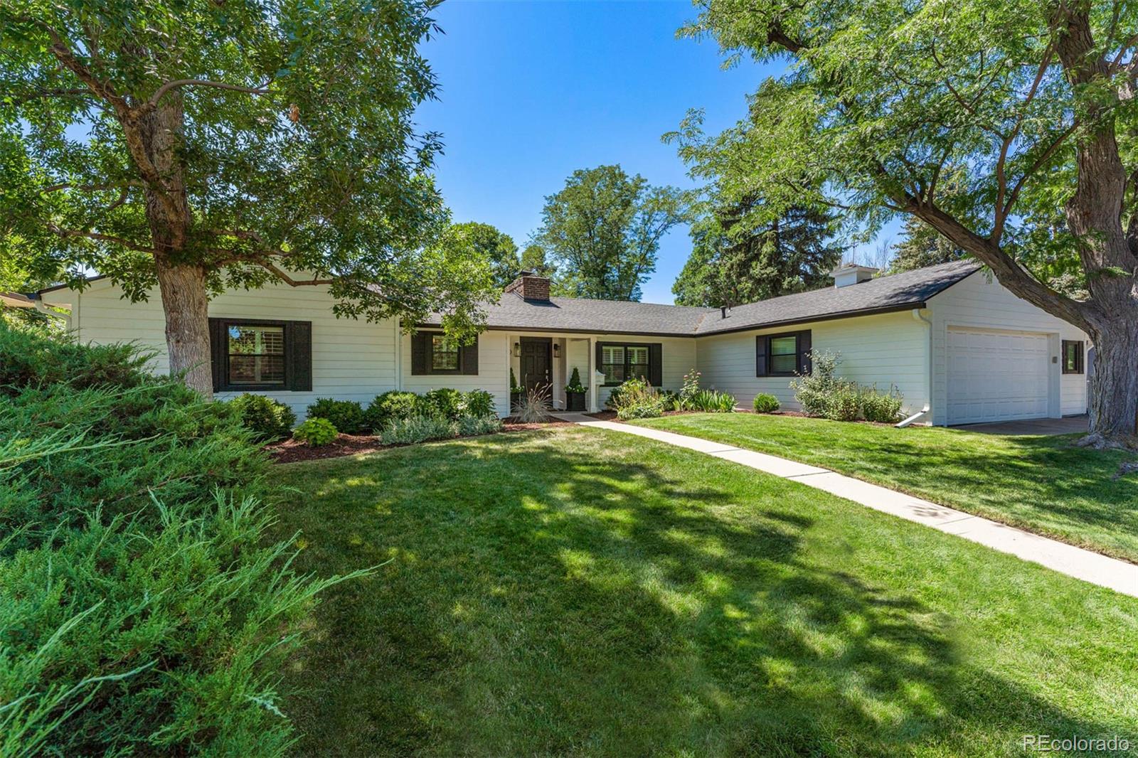 3800 East Dartmouth Avenue Denver, CO 80210 - Photo 2 of 50 a front view of house with yard and green space