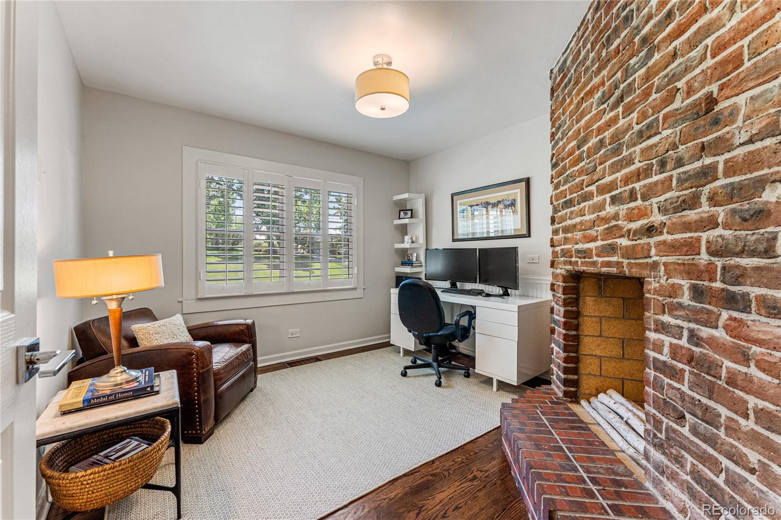 3800 East Dartmouth Avenue Denver, CO 80210 - Photo 23 of 50 a view of a workspace with furniture and a window