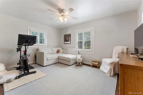 a bedroom with furniture and a flat screen tv