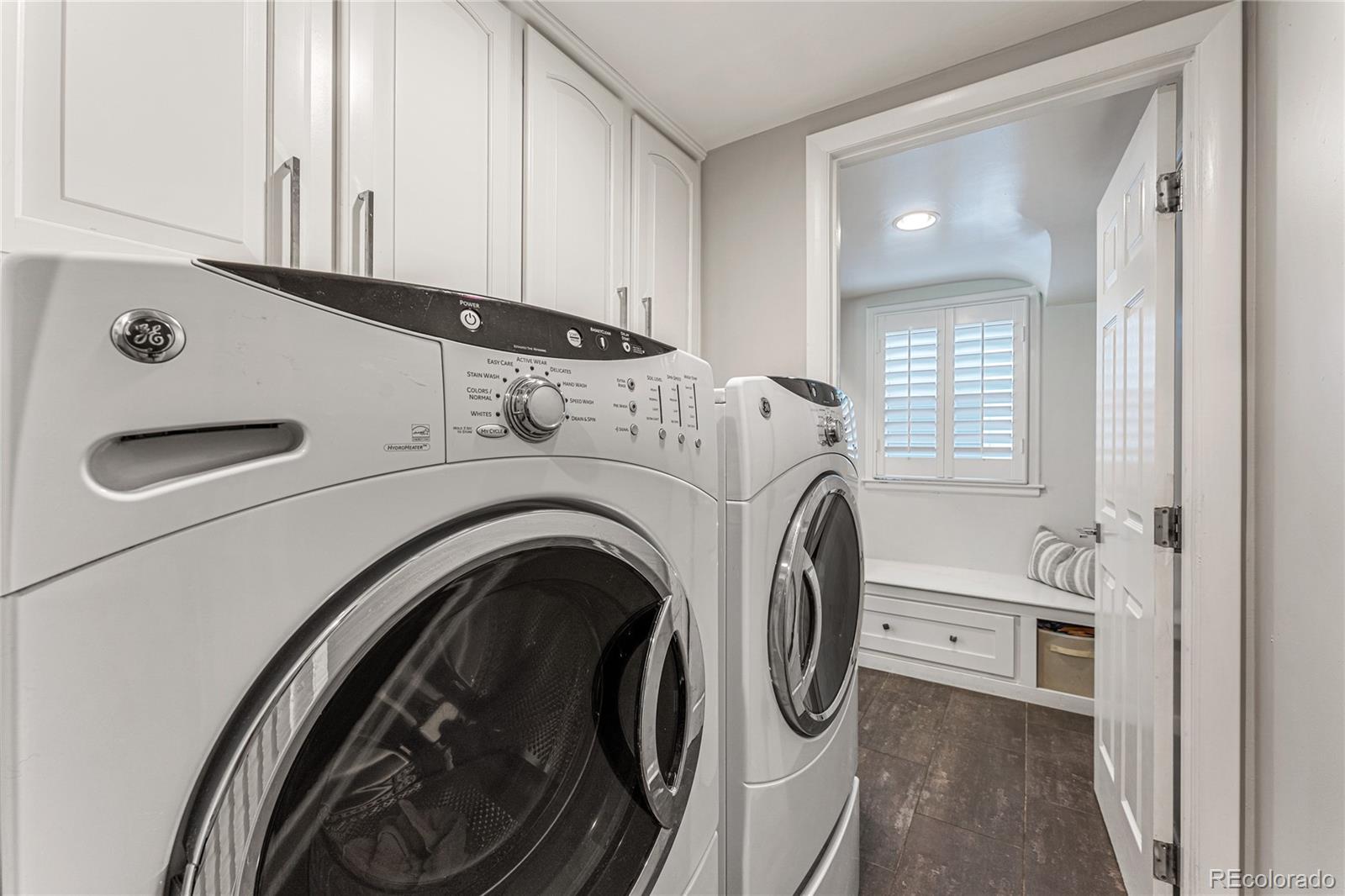 3800 East Dartmouth Avenue Denver, CO 80210 - Photo 28 of 50 a view of a storage and utility room with washer and dryer