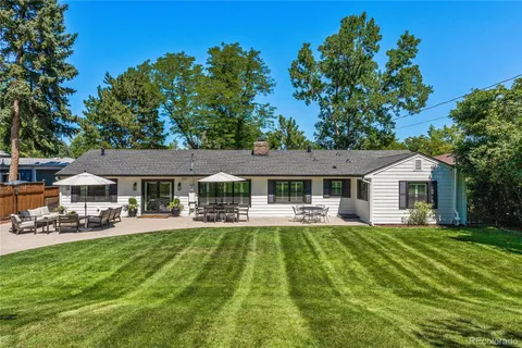 a house view with a sitting space and garden