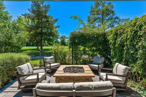a view of a patio with couches chairs and a table