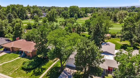 an aerial view of a house with a yard