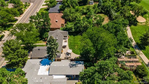 an aerial view of a house with a yard and garden