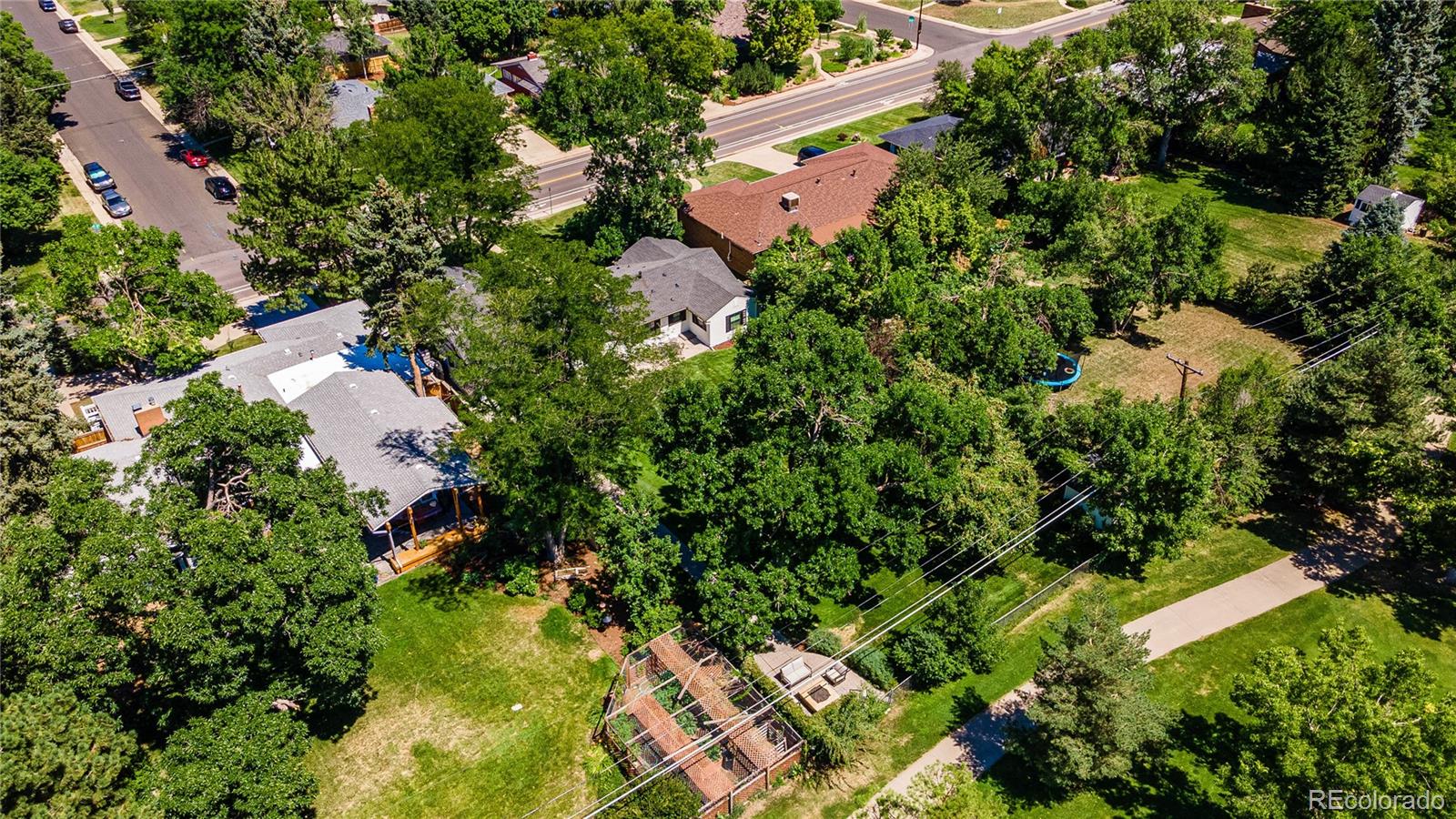 3800 East Dartmouth Avenue Denver, CO 80210 - Photo 43 of 50 an aerial view of residential house with outdoor space and trees all around