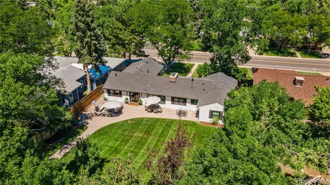an aerial view of a house with yard swimming pool and outdoor seating